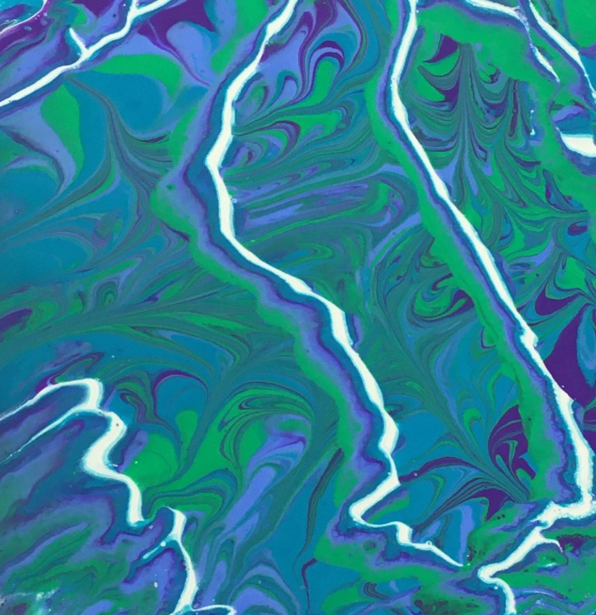 Green, blue and white marbled pour over art, made with acrylic paint