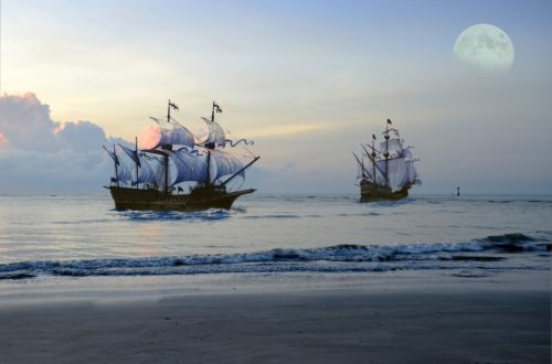 Pirate ships at sea with the moon in the sky for a dreamy landscape